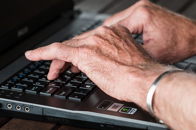 image of hands on a keyboard typing